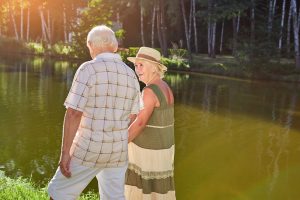 Couple of seniors near lake with Medigap Plan N