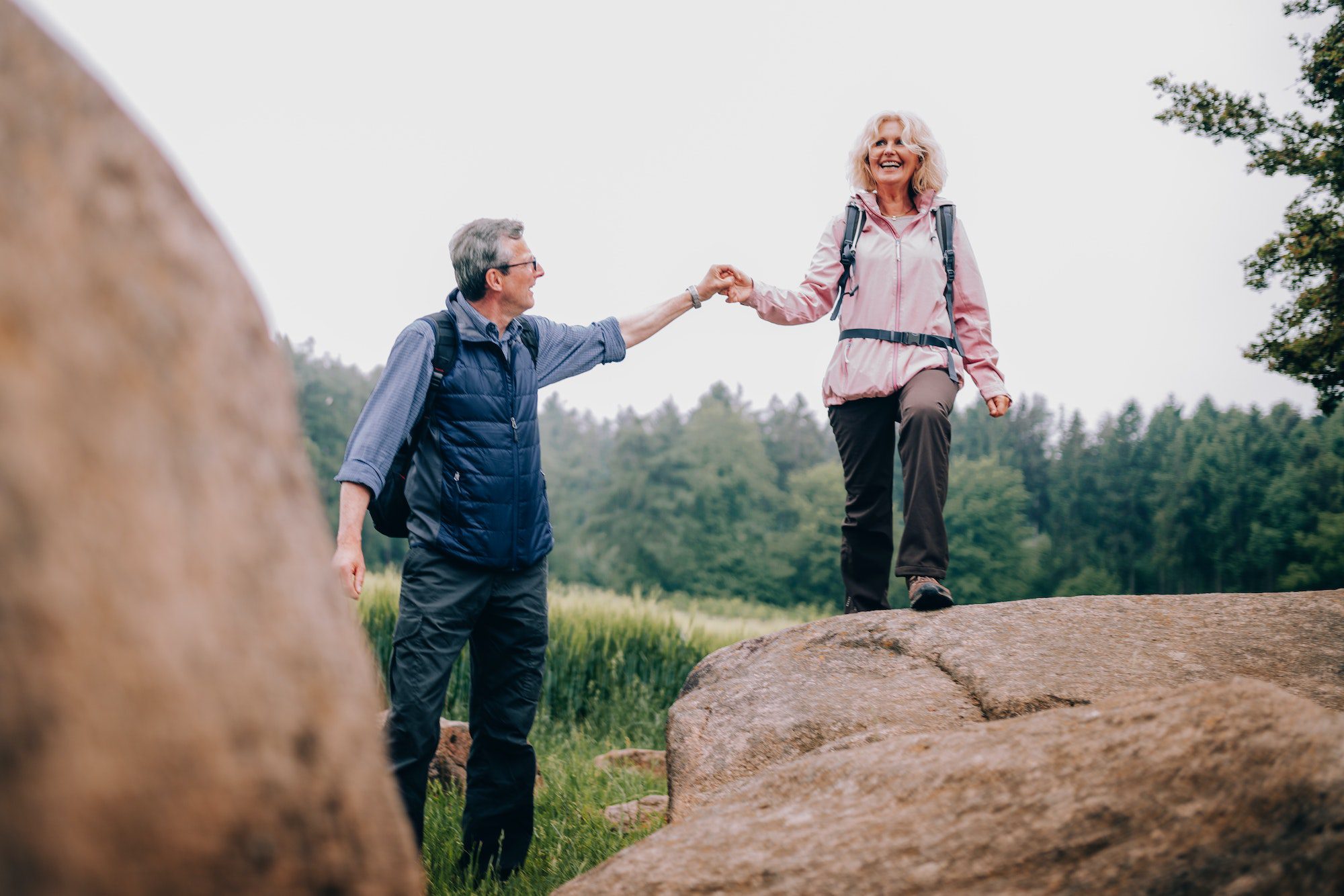 cute Senior couple going for a walk in nature with Medigap Plan F
