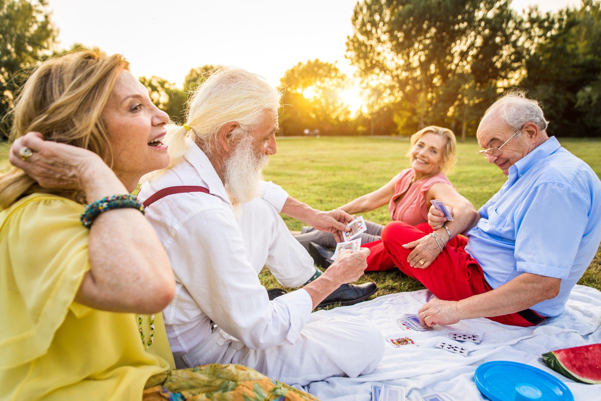 Group of senior people bonding outdoors with Medicare