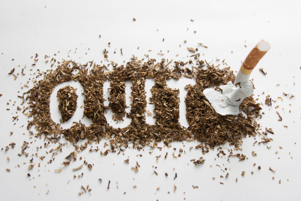 Broken cigarette with the word "quit"
