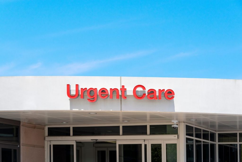 Urgent care clinic sign on outside of building