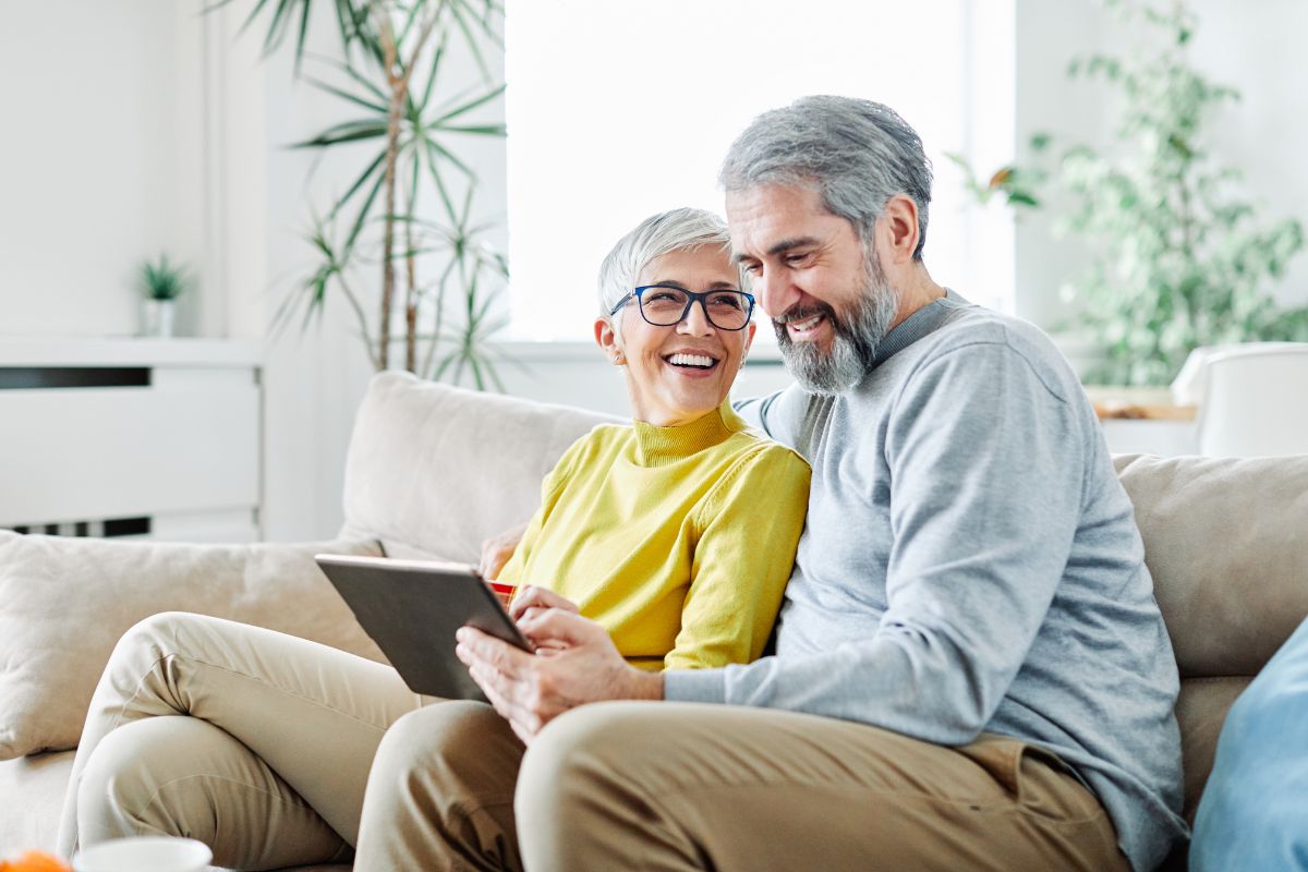 Happy couple who just completed their Medicare enrollment during their Initial Enrollment Period