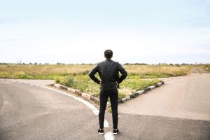 Person standing at a crossroads, making a choice between Medicare Advantage and Plan G