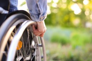 Person in wheelchair who has Medicare due to a disability