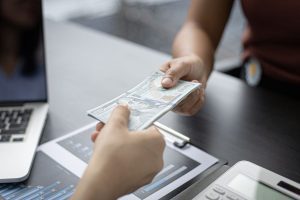 Person getting money back as part of their medicare advantage giveback plan