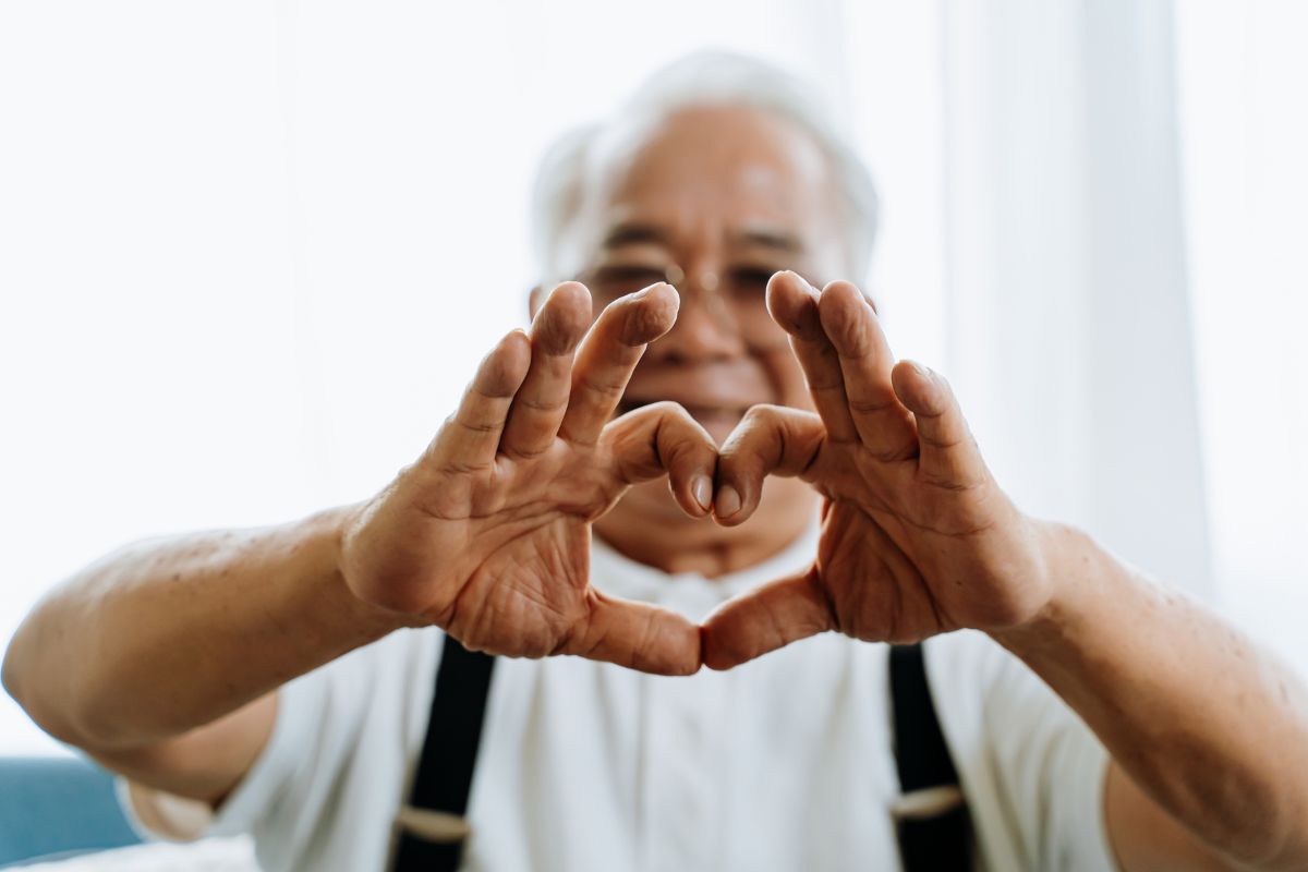 Man with heart hands, happy he is using Clever RX