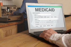 Person enrolling in Medicaid online