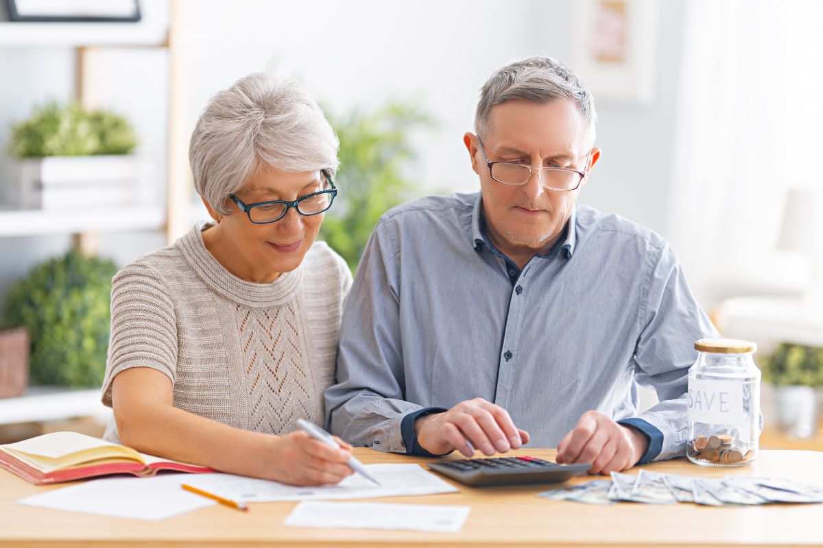 A couple going over their retirement budget, trying to figure out how to live on social security and no other income