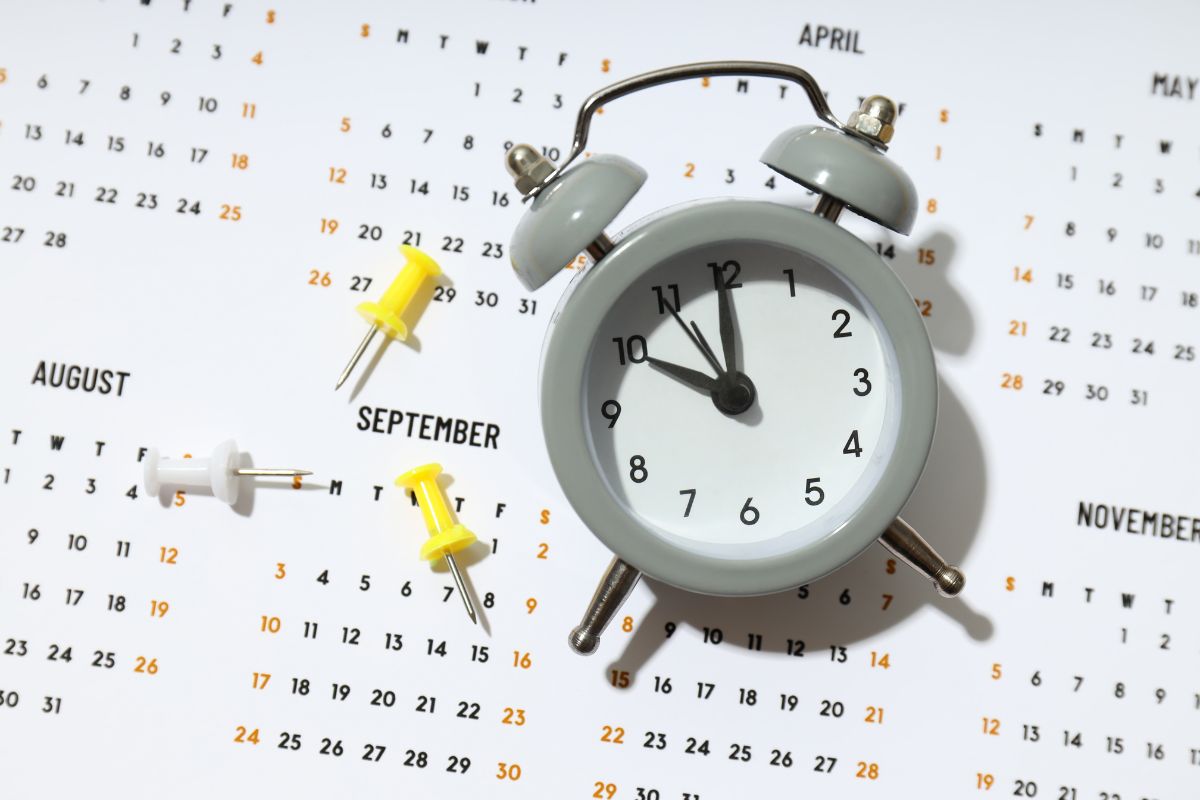 Clock with enrollment deadlines in the background