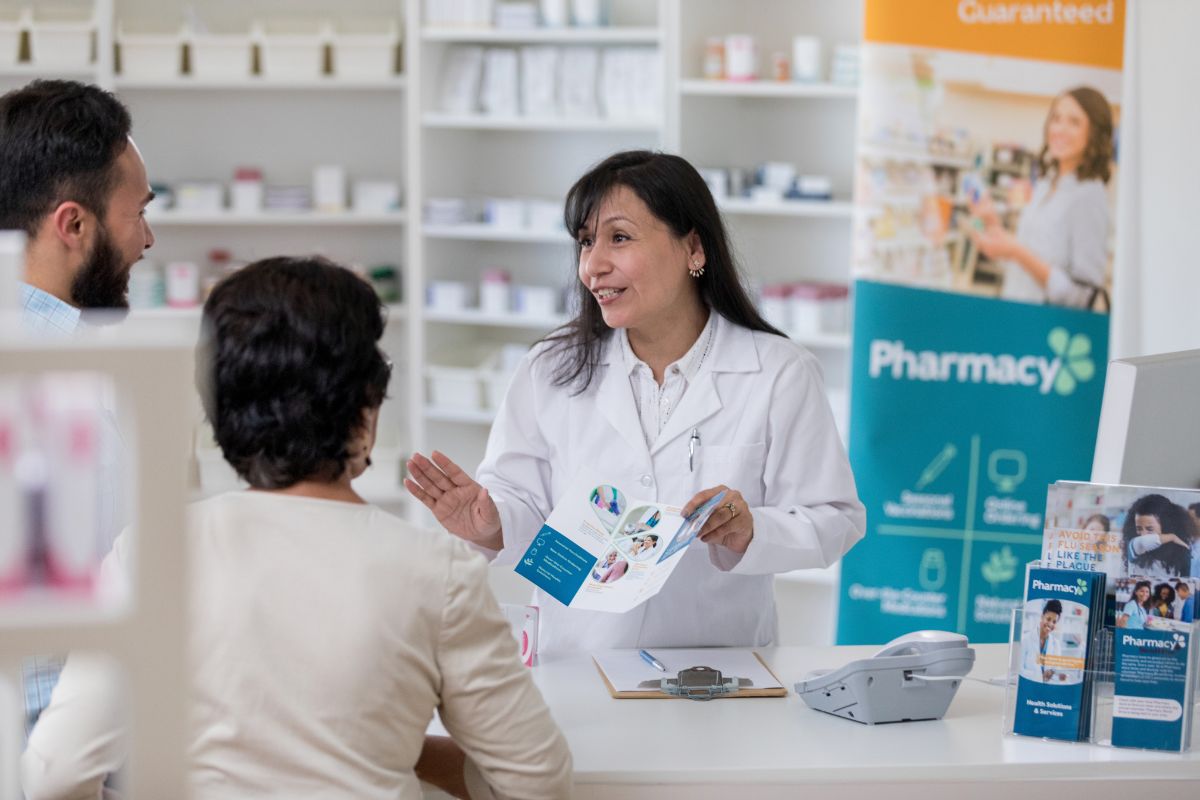 Pharmacist helping with new Medicare Part D plans