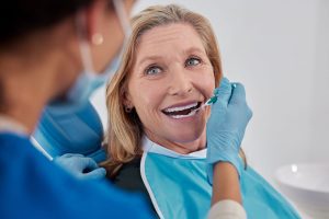 Medicare beneficiary getting dental treatment with ancillary insurance plan