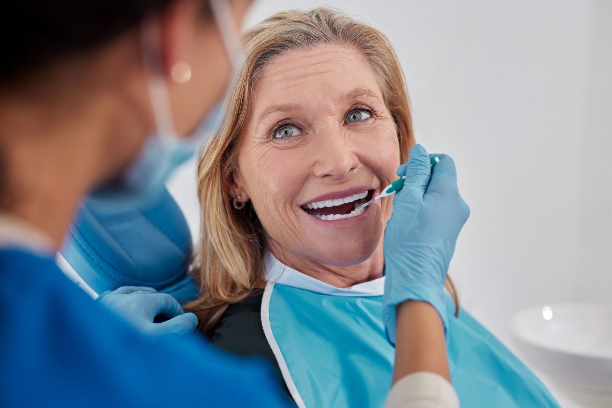 Medicare beneficiary getting dental treatment with ancillary insurance plan