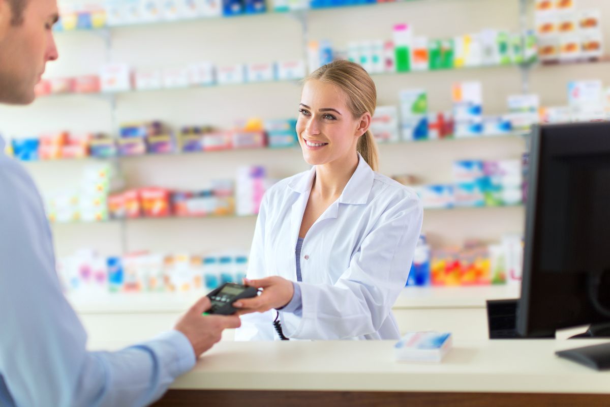 Pharmacist helping Medicare beneficiary with their Part D payment plan