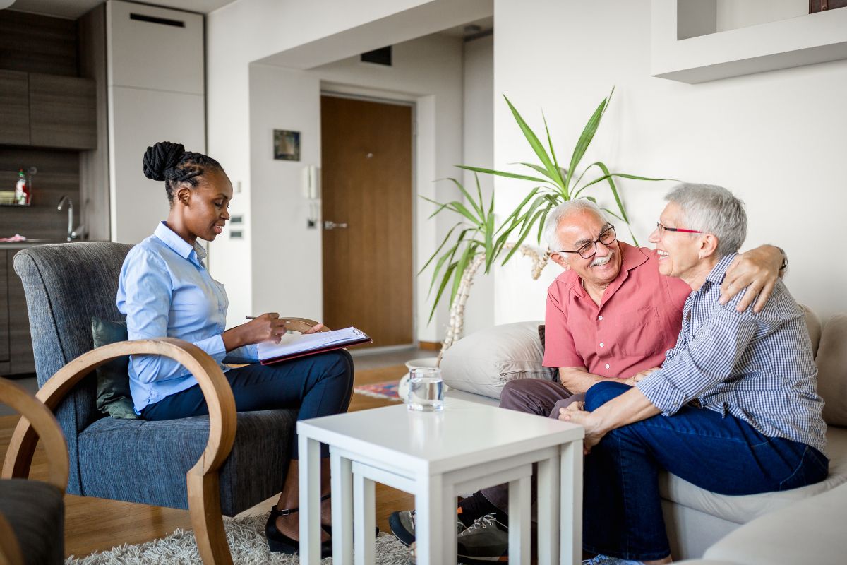 Elderly couple discussing long-term care options with their Medicare advisor