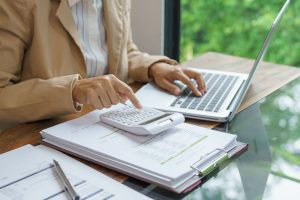 Medicare beneficiary calculating the costs of Medicare